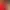 Deux cocottes en fonte, l'une rouge et l'autre blanche, posées sur une plaque de cuisson avec des aliments à l'intérieur de la cocotte rouge